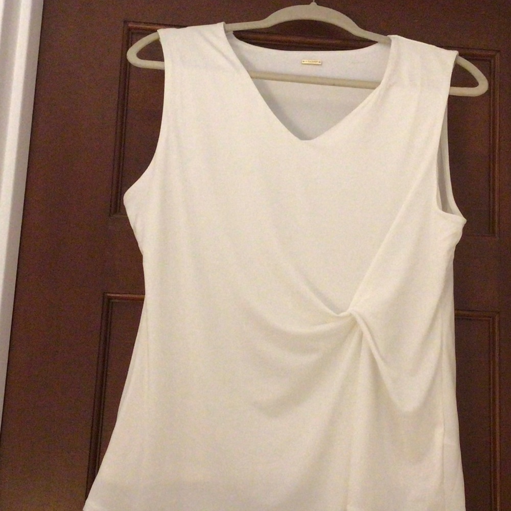Sexy Ivory Sleeveless Top With a Twist.